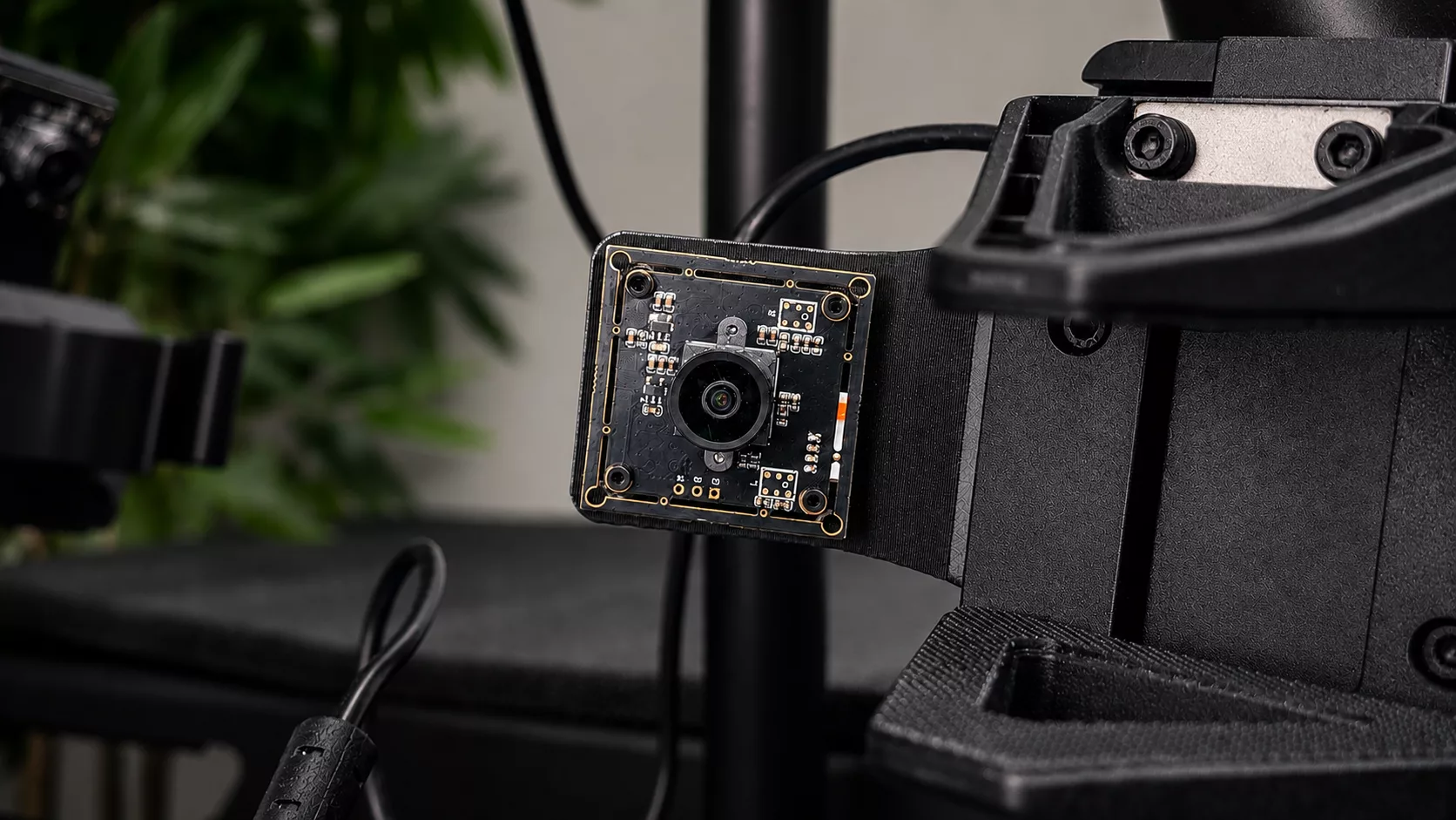 Close-up of the onboard camera board mounted on a robotic arm
